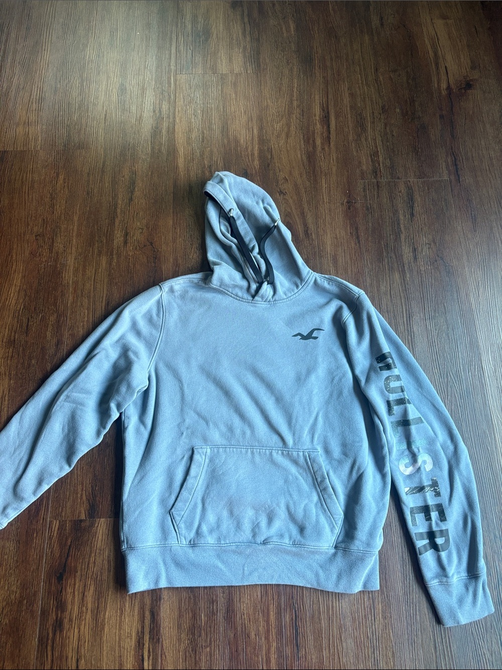 Hollister Men's Light Blue Hooded Pullover with Sleeve Logo and back design